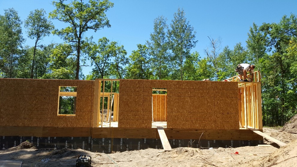 Inspiration for a rustic concrete fiberboard multicolored home design remodel in Minneapolis
