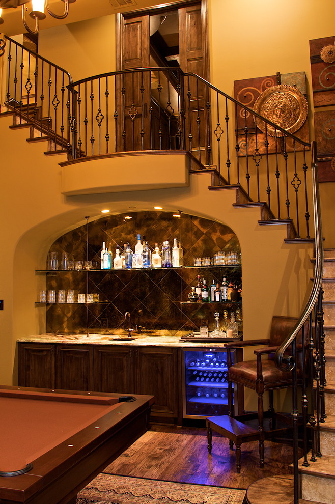 Photo of a mediterranean wood l-shaped staircase in Dallas.