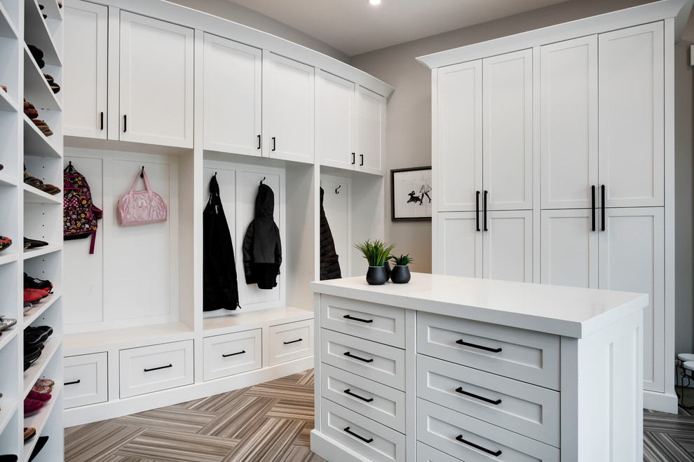 Inspiration for a huge transitional porcelain tile and gray floor mudroom remodel in Calgary with gray walls