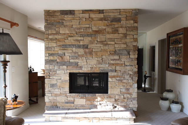 Custom colored ledge stone dry stack stone double sided fireplace