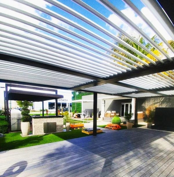 Example of a large trendy backyard patio design in Phoenix with a pergola