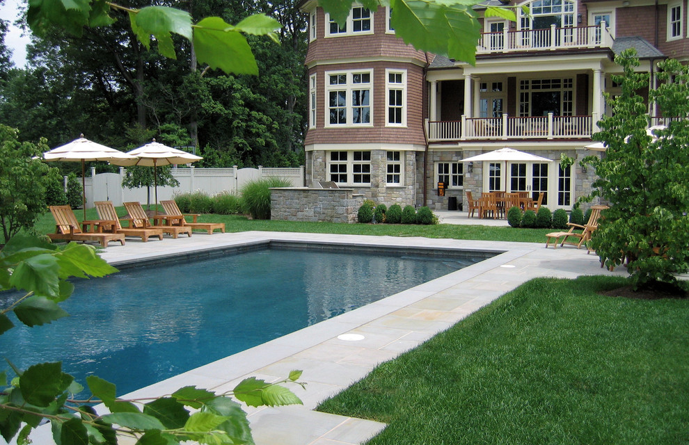 This is an example of a traditional backyard rectangular pool in New York.