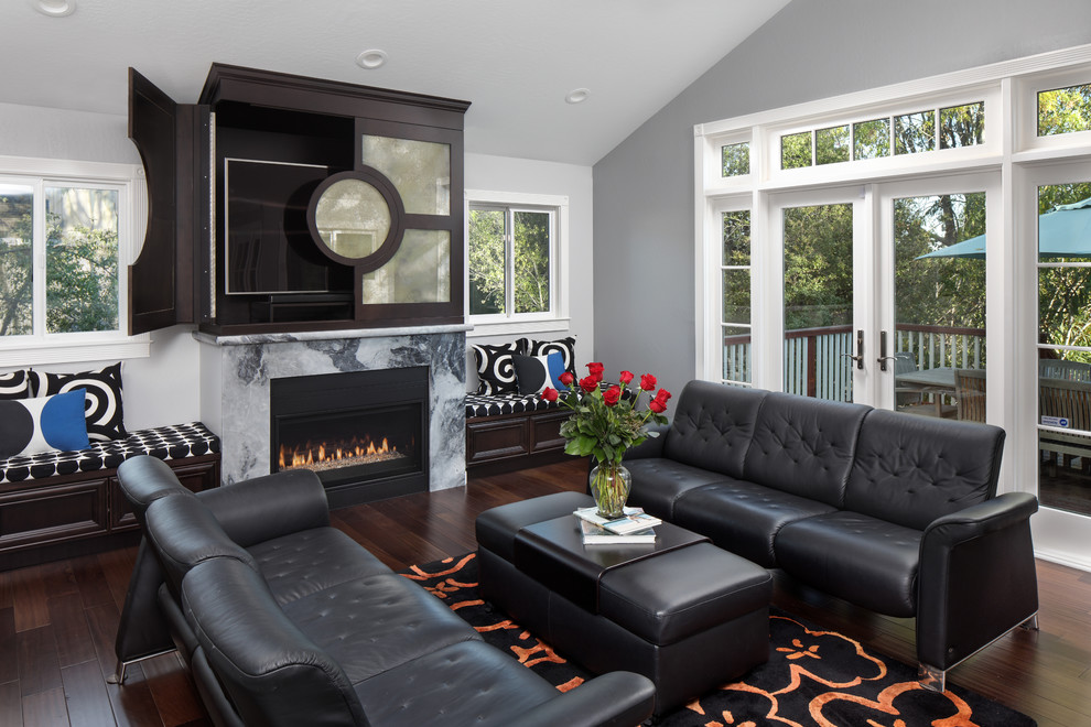 Design ideas for a mid-sized transitional family room in San Francisco with grey walls, dark hardwood floors, a ribbon fireplace and a concealed tv.