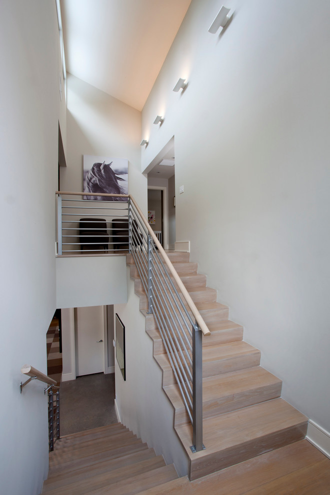 Photo of a mid-sized modern tile u-shaped staircase in Orlando with tile risers.