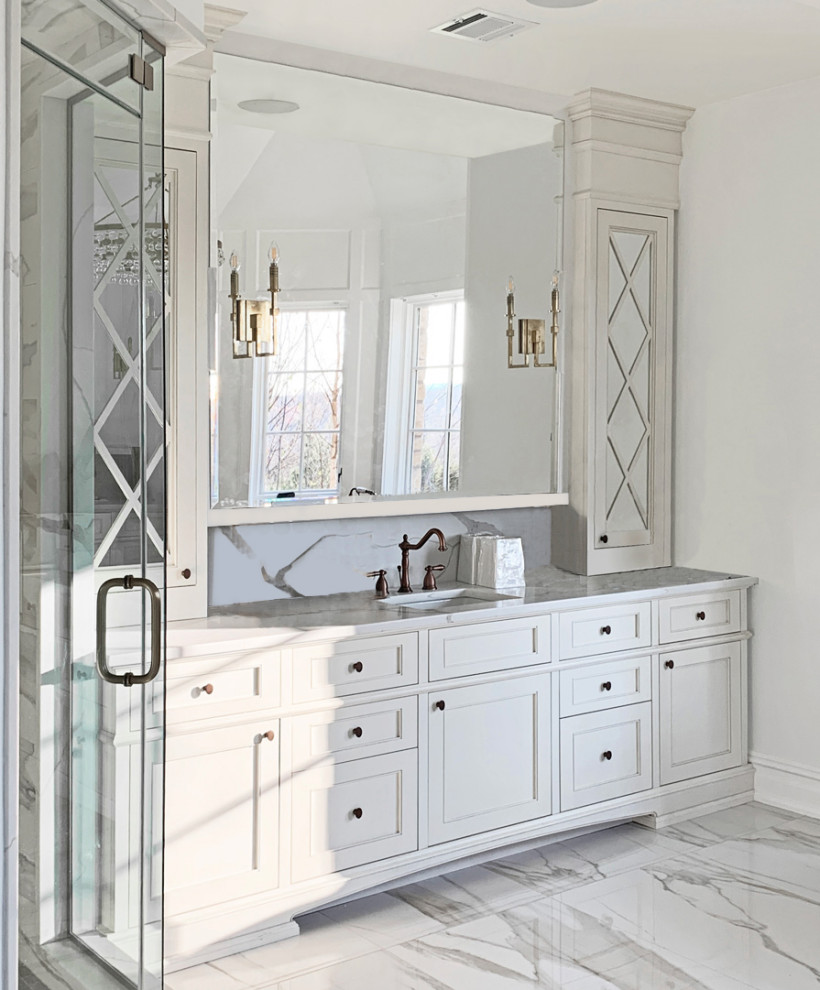 Example of a mid-sized transitional master white tile and ceramic tile white floor and single-sink japanese bathtub design in New York with shaker cabinets, white cabinets, white walls, a drop-in sink, quartz countertops, white countertops and a built-in vanity
