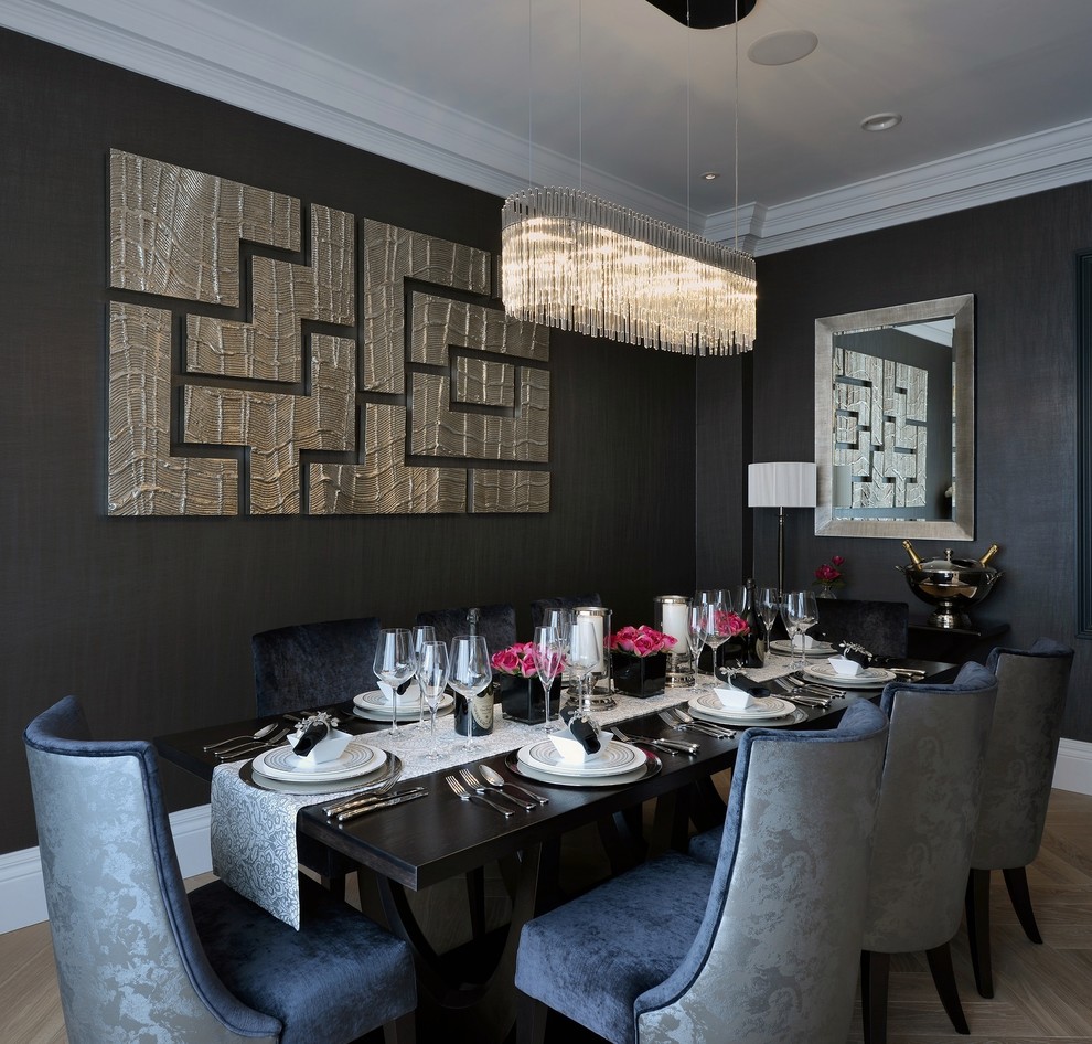 Inspiration for a contemporary dining room in London with medium hardwood floors.