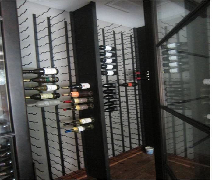 Inspiration for a small contemporary wine cellar in Dallas with storage racks and brown floor.