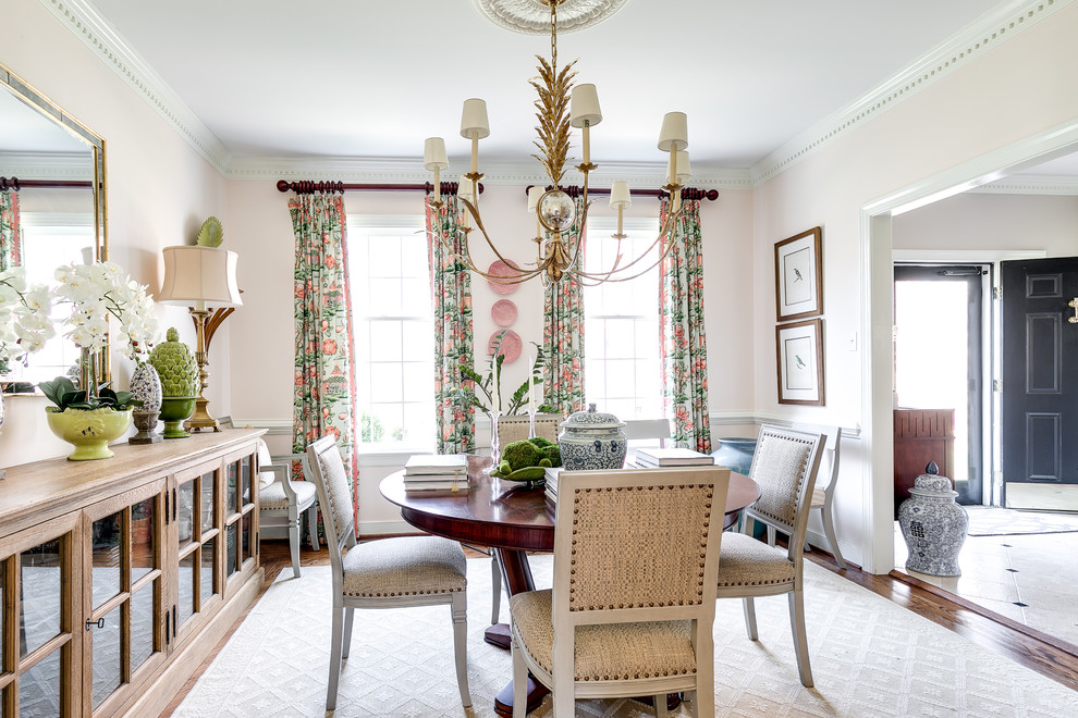Inspiration for a traditional separate dining room in Richmond with pink walls, dark hardwood floors and no fireplace.