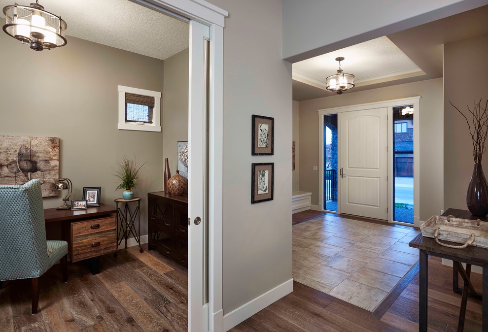 Mid-sized transitional foyer in Calgary with beige walls, ceramic floors, a pivot front door and a white front door.
