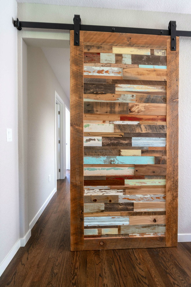 Inspiration for a transitional dark wood floor and brown floor hallway remodel with white walls