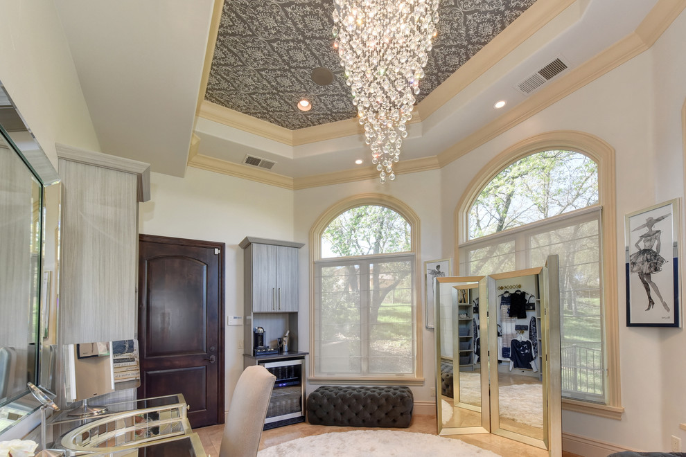 Inspiration for an expansive transitional women's dressing room in Sacramento with open cabinets, grey cabinets, limestone floors and beige floor.