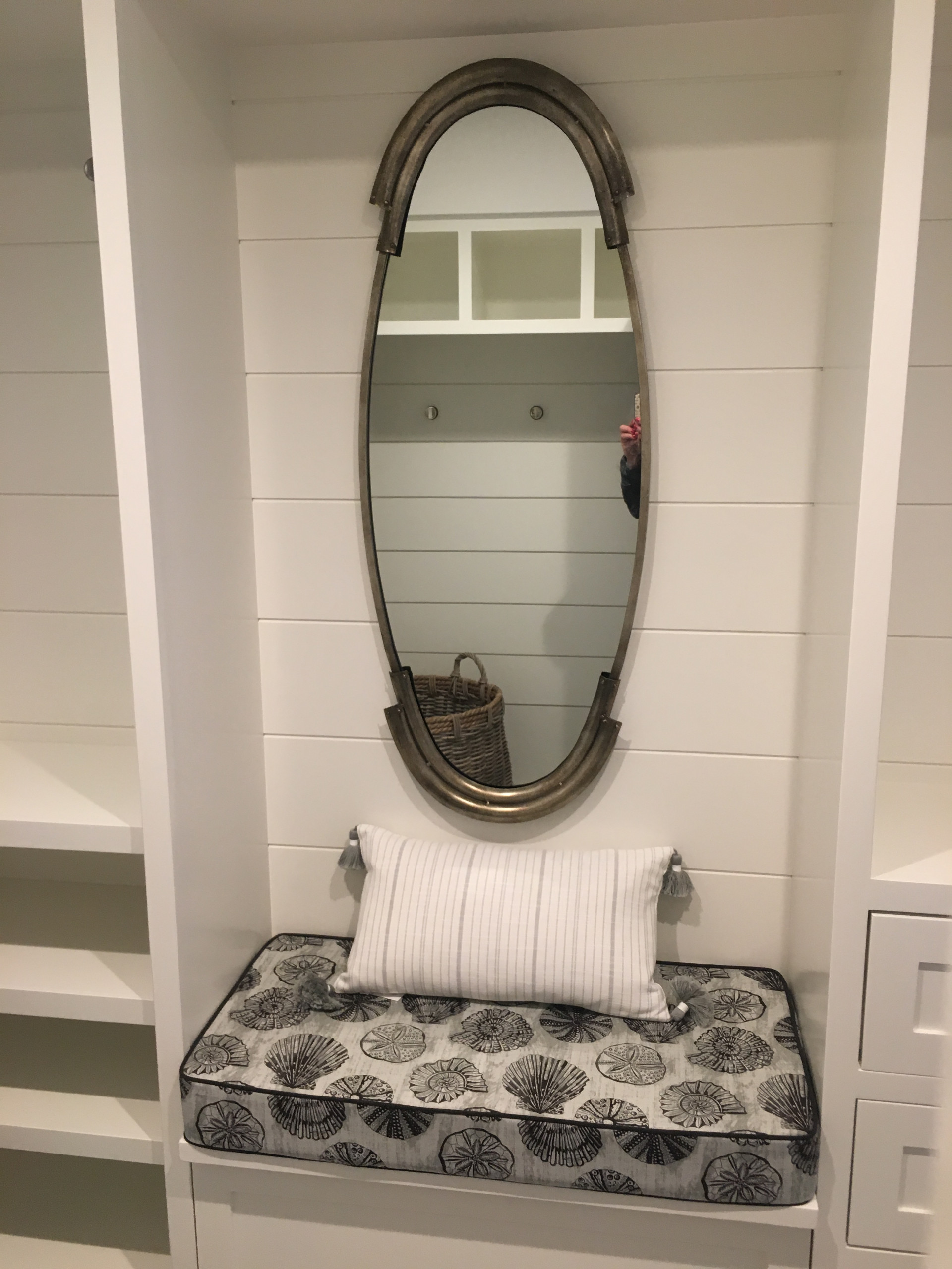 A fully equipped laundry room with a built ins