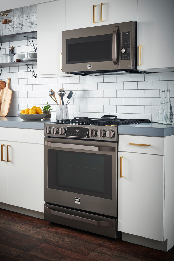 Stainless steel transitional kitchen photo in New York