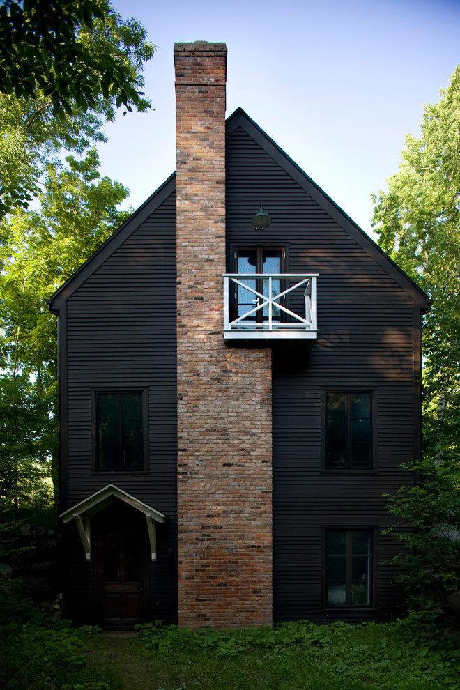 Inspiration for a scandinavian two-storey black exterior in Montreal.