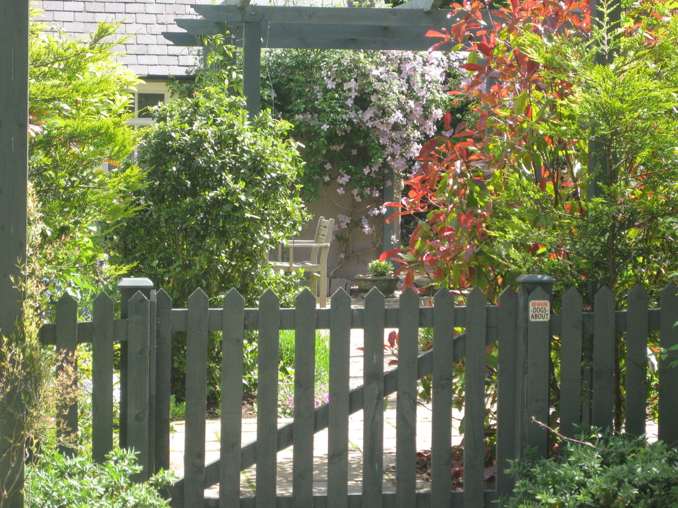 This is an example of a medium sized traditional garden in Other.