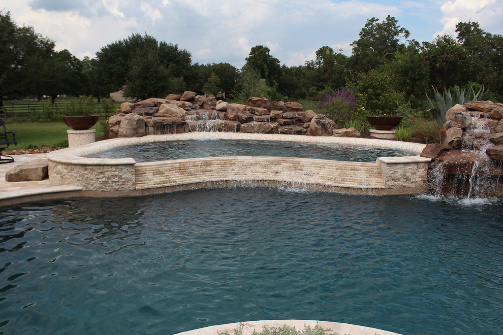 Inspiration for a large transitional pool remodel in Houston