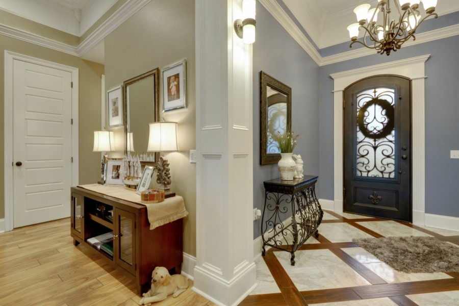 Mid-sized transitional foyer in Other with blue walls, marble floors, a single front door and a brown front door.