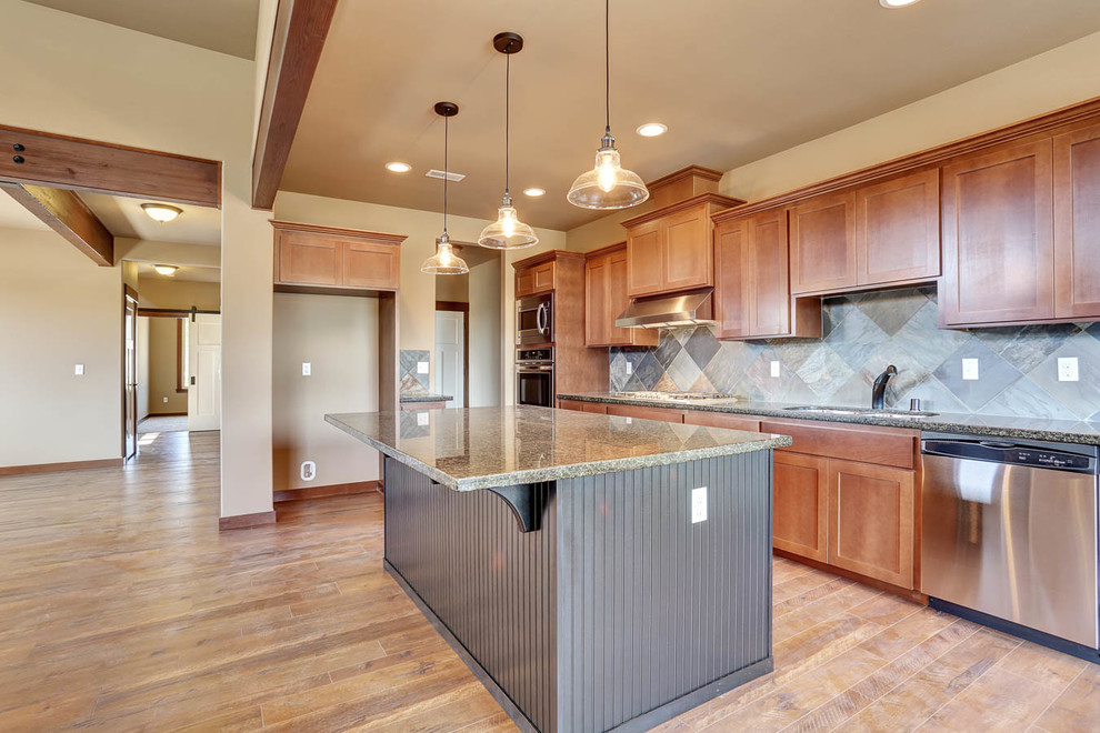 Example of a mid-sized mountain style galley dark wood floor open concept kitchen design in Seattle with an undermount sink, beaded inset cabinets, black cabinets, granite countertops, multicolored backsplash, stone tile backsplash, stainless steel appliances and an island