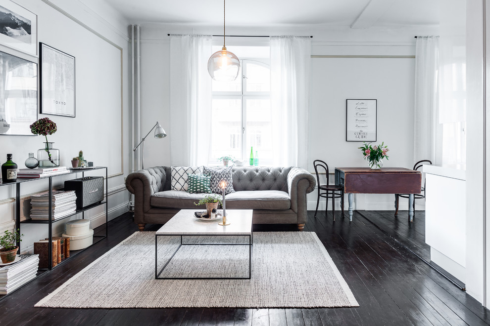 Inspiration for a large scandinavian formal open concept living room in Stockholm with white walls, no fireplace and no tv.