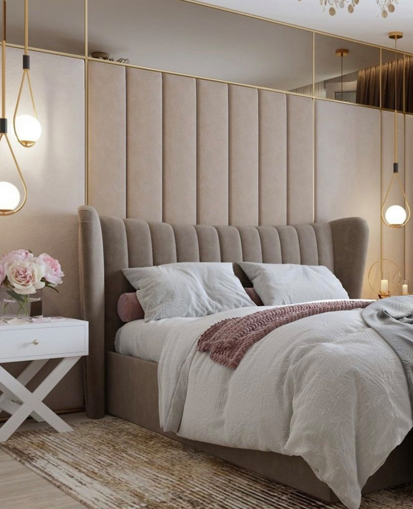 This is an example of a large modern grey and pink bedroom in London with beige walls, light hardwood flooring, panelled walls and a feature wall.