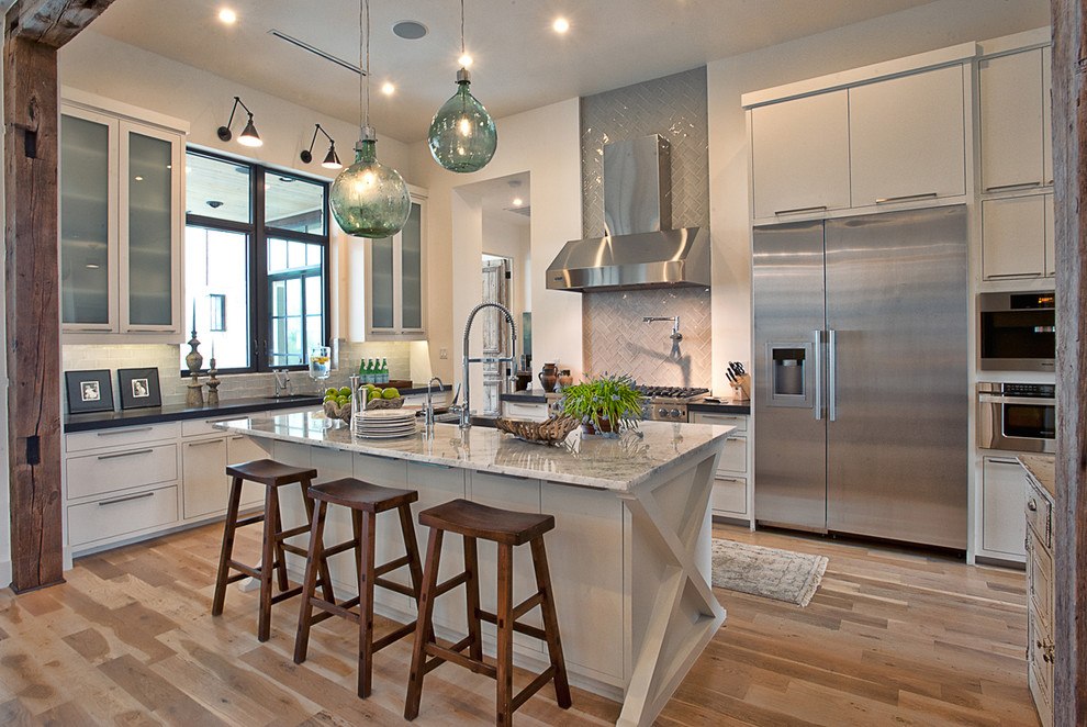 Design ideas for a contemporary kitchen in Austin with stainless steel appliances.