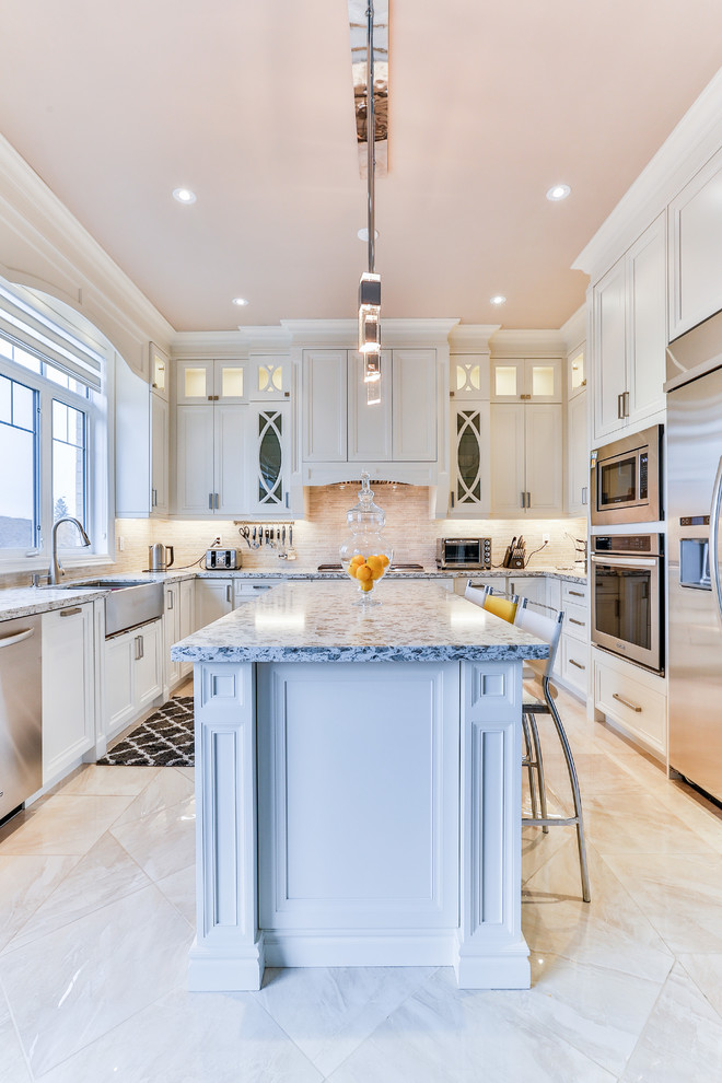 Example of a transitional kitchen design in Toronto