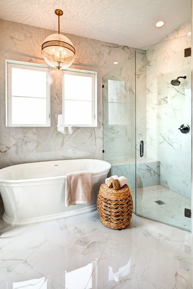 Inspiration for a large traditional master bathroom in Salt Lake City with furniture-like cabinets, light wood cabinets, a freestanding tub, a corner shower, a one-piece toilet, multi-coloured tile, marble, multi-coloured walls, marble floors, an undermount sink, marble benchtops, multi-coloured floor, a hinged shower door and multi-coloured benchtops.