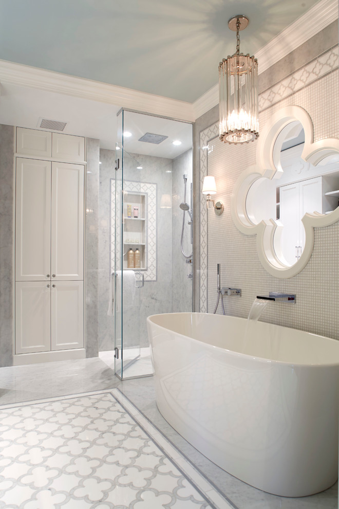 Inspiration for a traditional master bathroom in Montreal with a freestanding tub, a curbless shower, gray tile and a hinged shower door.