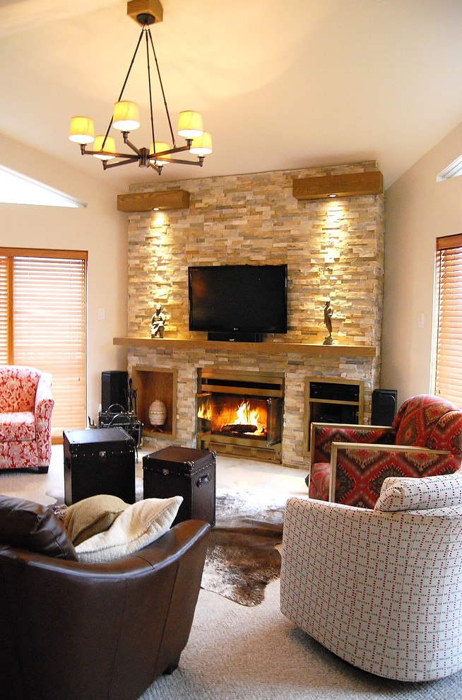 Photo of a transitional living room in Montreal with carpet, a standard fireplace and a stone fireplace surround.