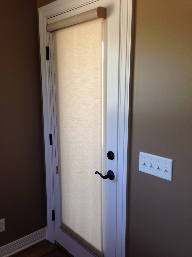 Entryway - transitional entryway idea in Omaha with a white front door