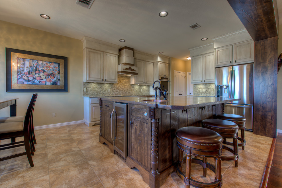 Inspiration for a mid-sized rustic l-shaped eat-in kitchen remodel in Austin with a single-bowl sink, wood countertops, stainless steel appliances and an island