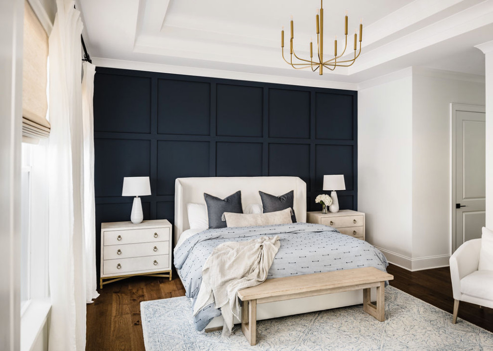 На фото: хозяйская спальня среднего размера в стиле неоклассика (современная классика) с белыми стенами, паркетным полом среднего тона, коричневым полом и панелями на стенах с