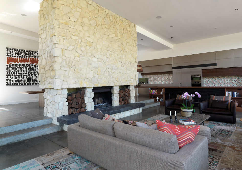 This is an example of a contemporary living room in Melbourne with concrete floors.