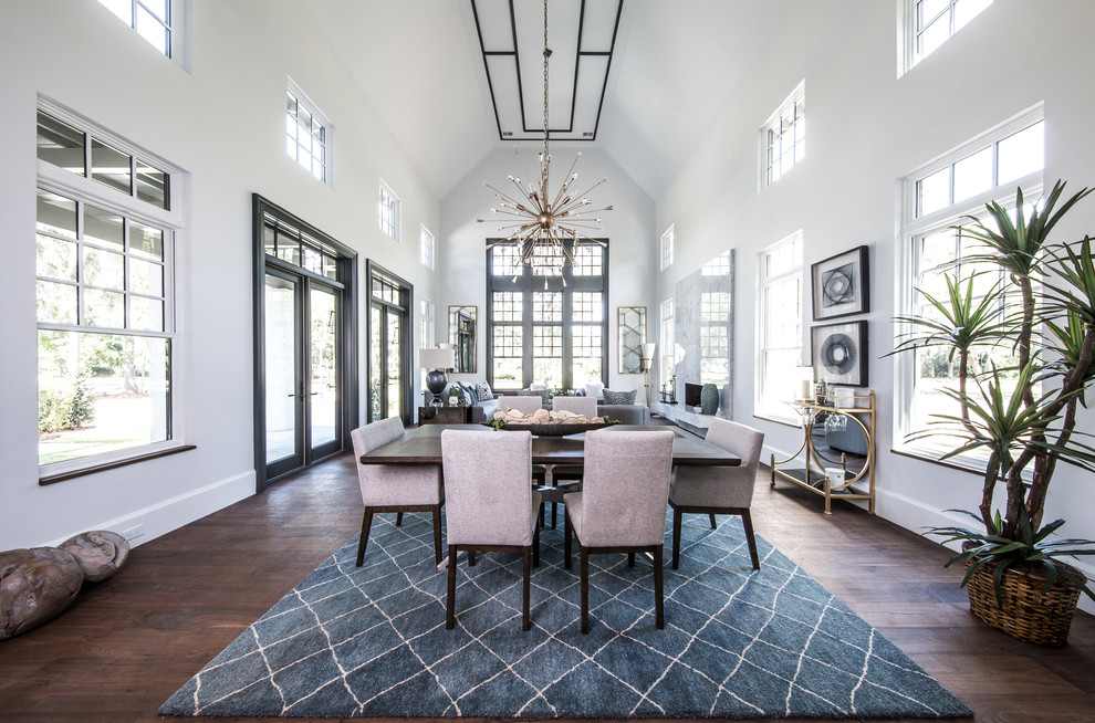 Inspiration for a transitional separate dining room in Atlanta with white walls, dark hardwood floors, a ribbon fireplace, a stone fireplace surround and brown floor.