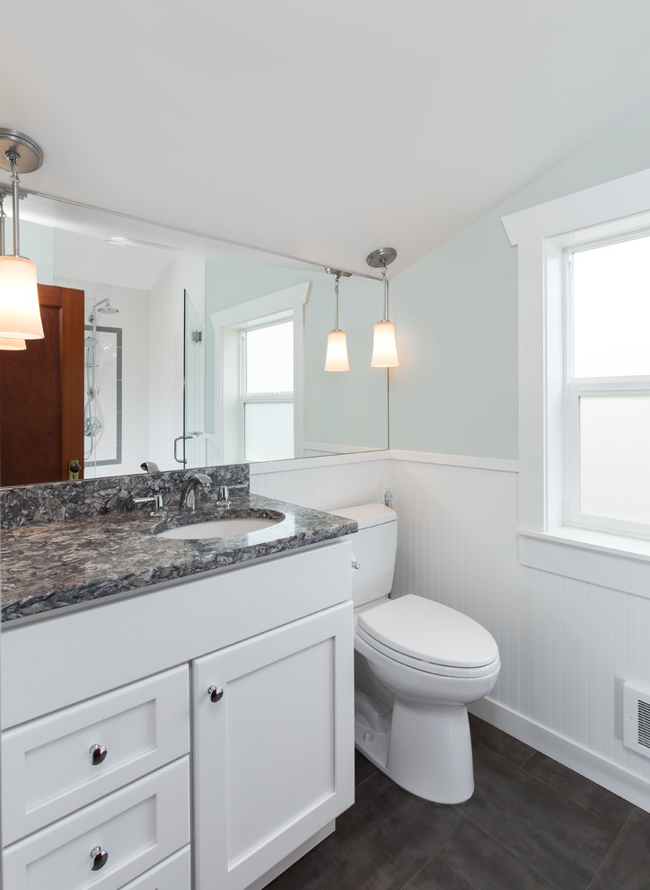 Small traditional master bathroom in Seattle with an undermount sink, shaker cabinets, white cabinets, engineered quartz benchtops, an alcove shower, a two-piece toilet, white tile, porcelain tile, blue walls and porcelain floors.