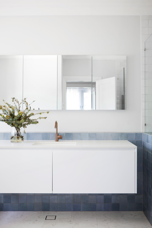 Serene Simplicity: Blue Backsplash and Floating Cabinet