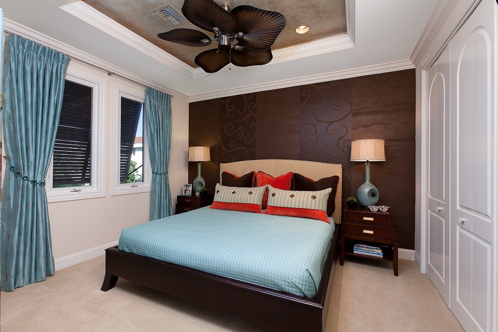 Photo of a contemporary bedroom in Miami with beige walls, carpet and no fireplace.