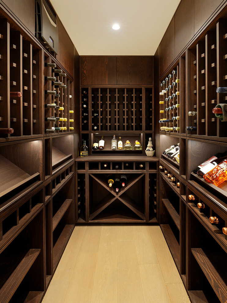 Inspiration for a contemporary wine cellar in London with yellow floor.