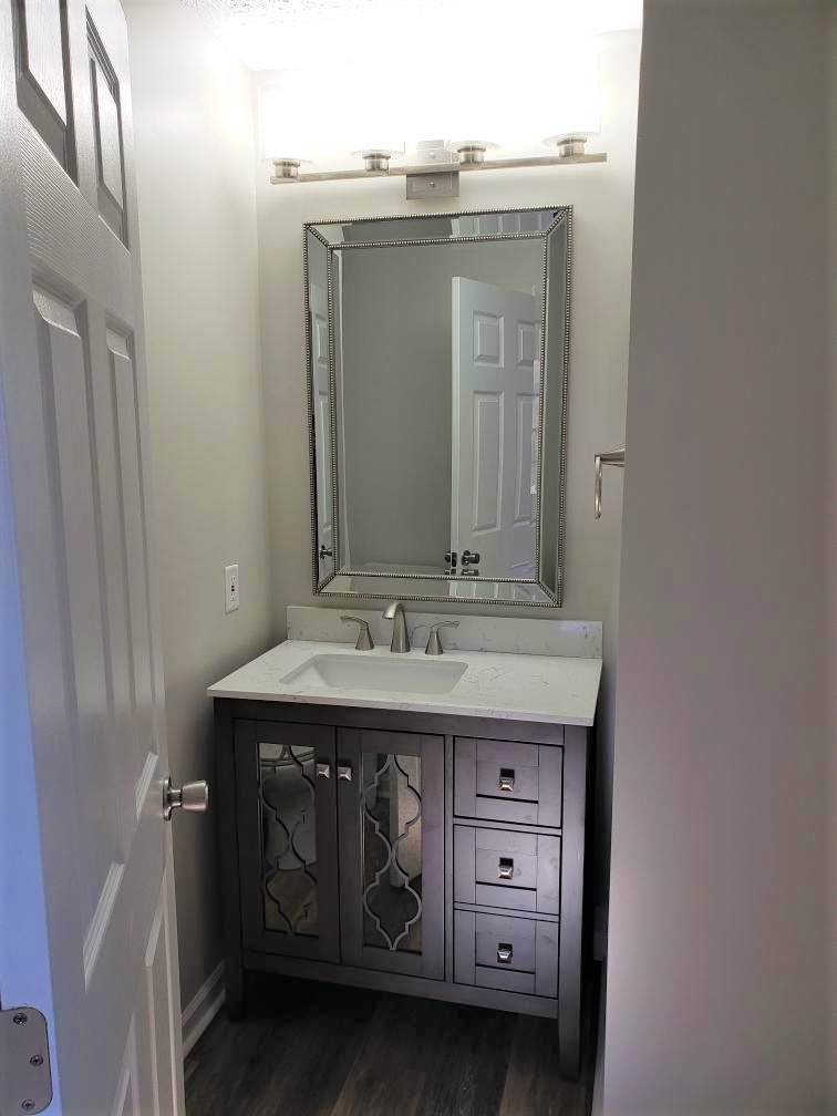 Two Bathroom Renovations and Custom Closet Shelving with Custom Tile Showers