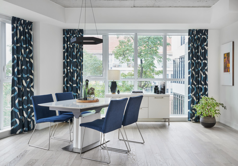 Kitchen/dining room combo - mid-sized contemporary light wood floor and beige floor kitchen/dining room combo idea in Toronto with white walls