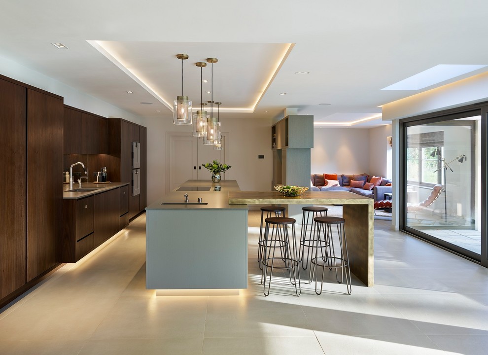 Design ideas for an expansive contemporary l-shaped open plan kitchen in Kent with a double-bowl sink, open cabinets, grey cabinets, quartzite benchtops, metallic splashback, mirror splashback, stainless steel appliances, ceramic floors, with island and beige floor.