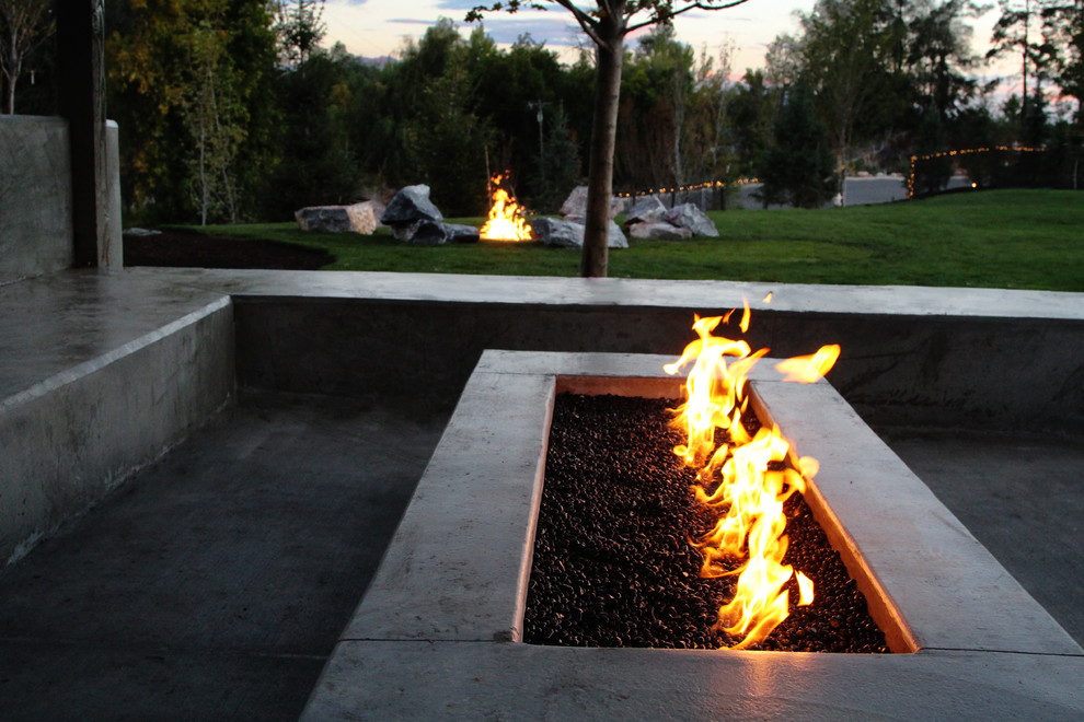 Design ideas for a large contemporary backyard garden in Salt Lake City with a fire feature.
