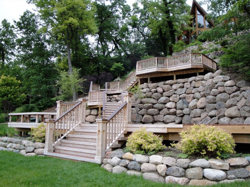Deck - large rustic backyard balcony deck idea in Detroit with no cover