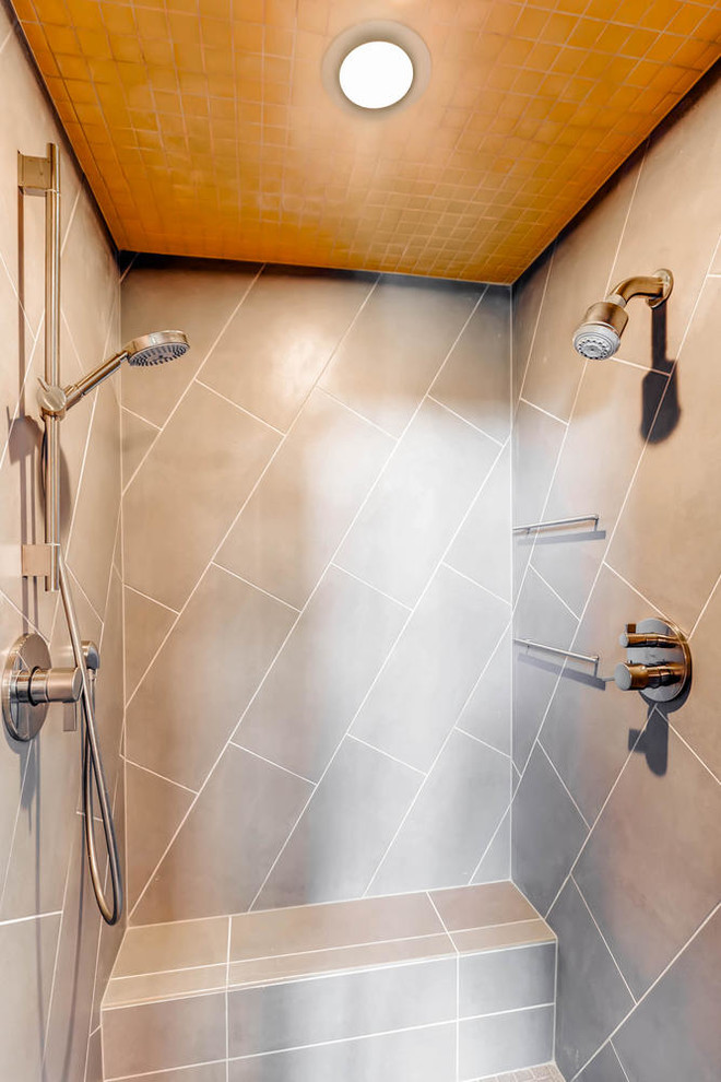 Mid-sized mountain style master black tile and cement tile concrete floor corner shower photo in Denver with flat-panel cabinets, light wood cabinets, a one-piece toilet, brown walls, a vessel sink and quartzite countertops