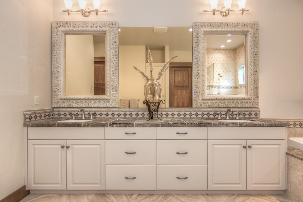 Mid-sized mountain style master beige tile bathroom photo with white cabinets, an undermount sink, tile countertops, white walls and recessed-panel cabinets