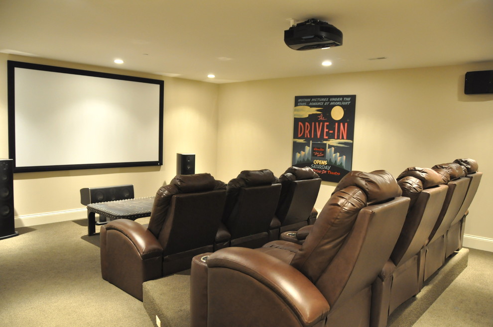 Large traditional enclosed home theatre in Chicago with yellow walls, carpet, a projector screen and beige floor.