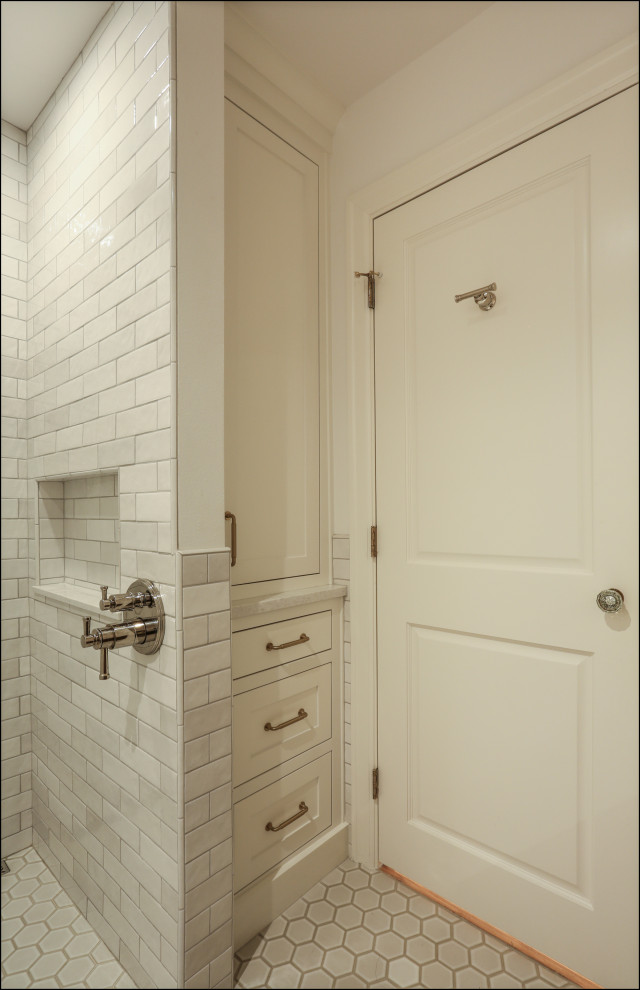 This is an example of a medium sized classic family bathroom in Portland with shaker cabinets, dark wood cabinets, a built-in shower, white tiles, porcelain tiles, white walls, porcelain flooring, a submerged sink, engineered stone worktops, white floors, an open shower, white worktops, a wall niche, a single sink, a built in vanity unit and wainscoting.