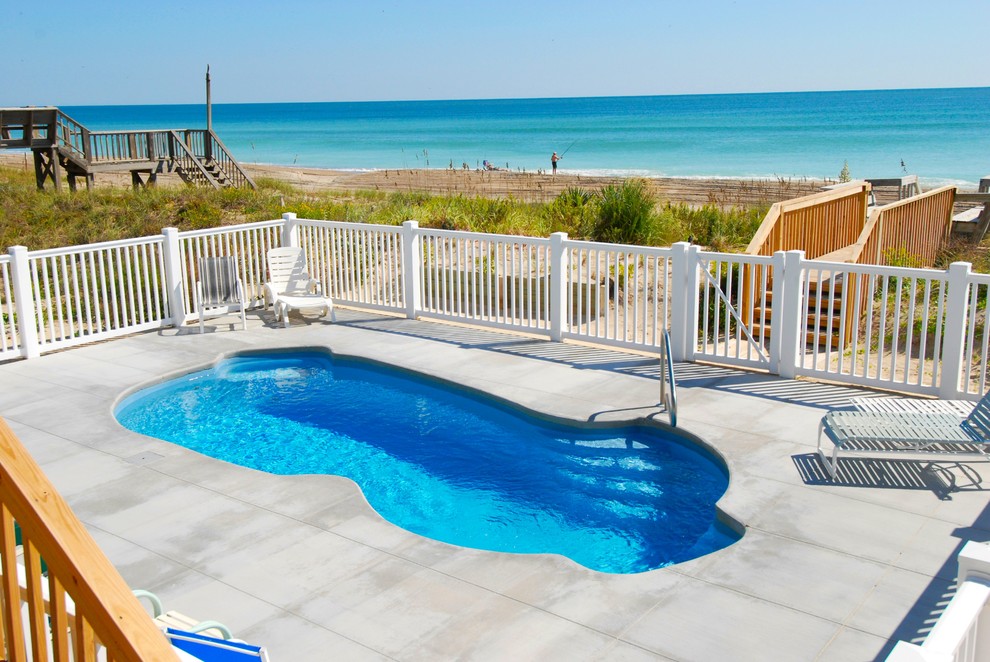 Example of a small beach style pool design
