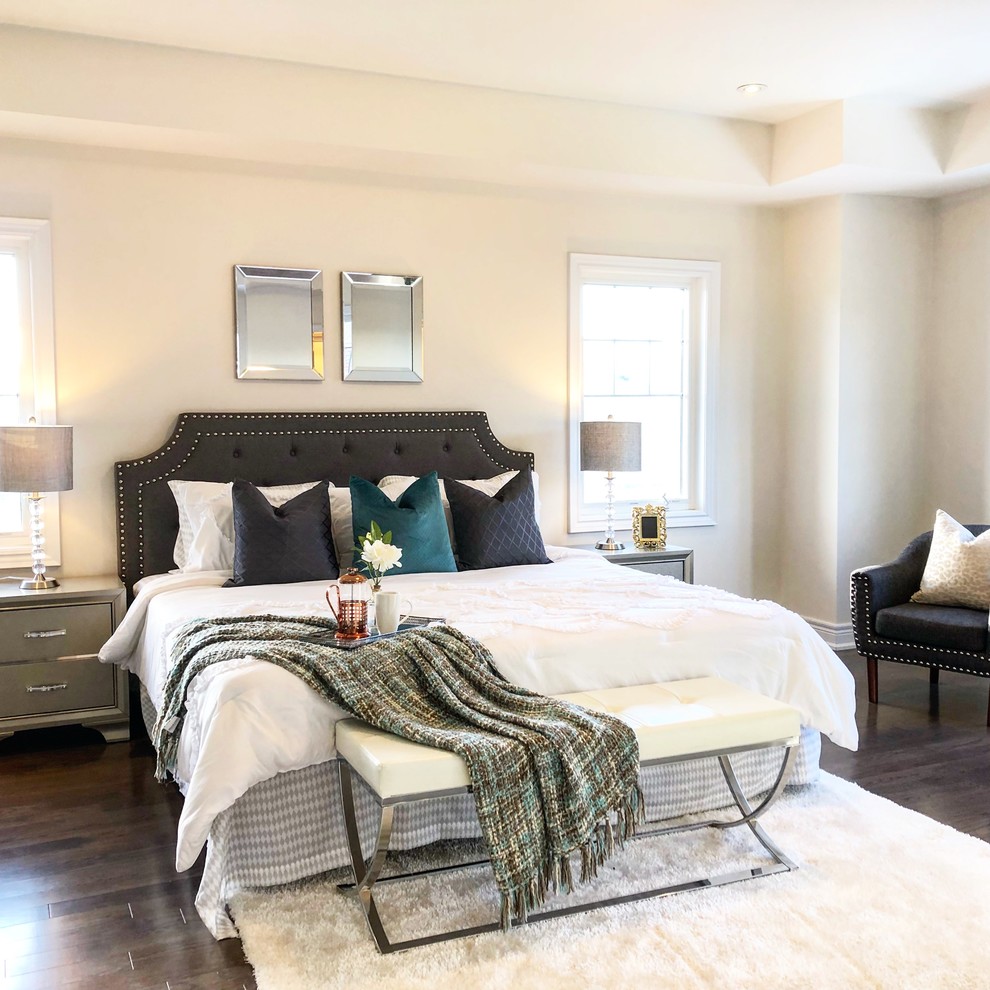 Mid-sized transitional bedroom in Toronto with white walls, dark hardwood floors and brown floor.