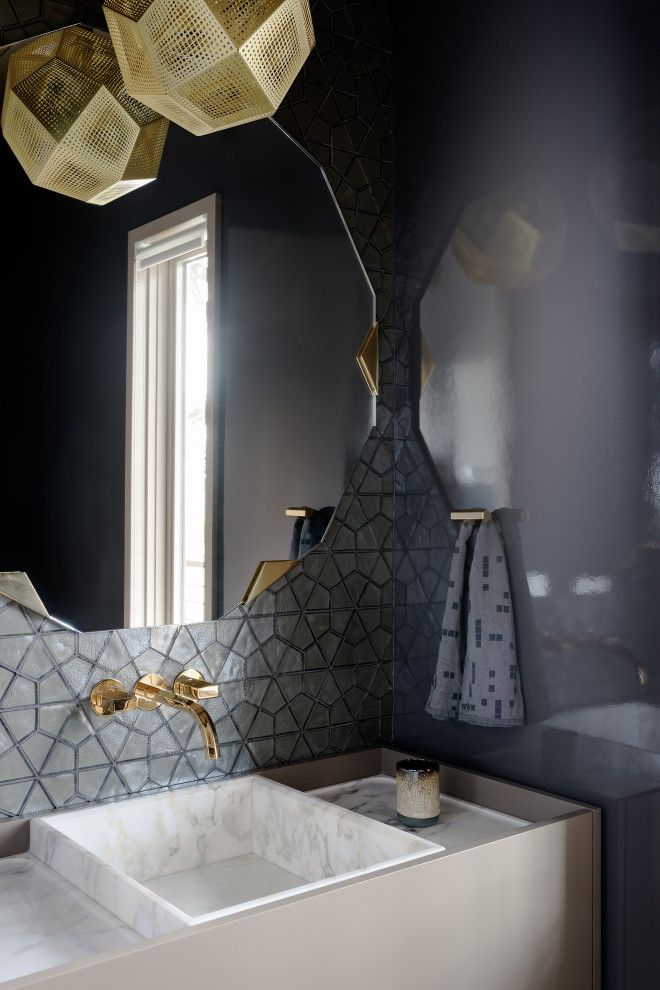 Inspiration for a modern gray tile powder room remodel in San Francisco with flat-panel cabinets, gray cabinets, gray walls, a vessel sink and white countertops